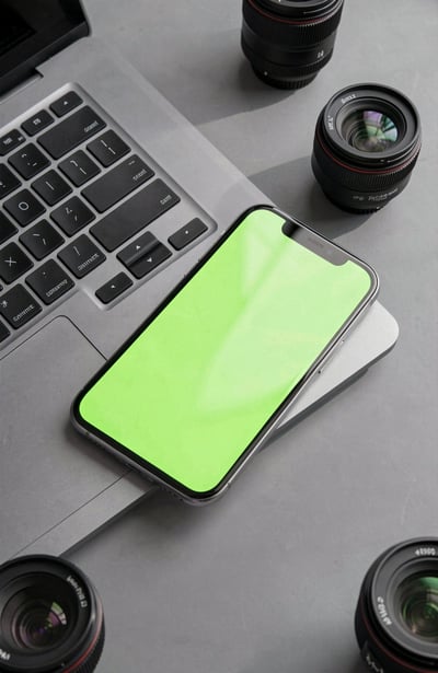 Smartphone on Laptop Keyboard with Camera Lenses
