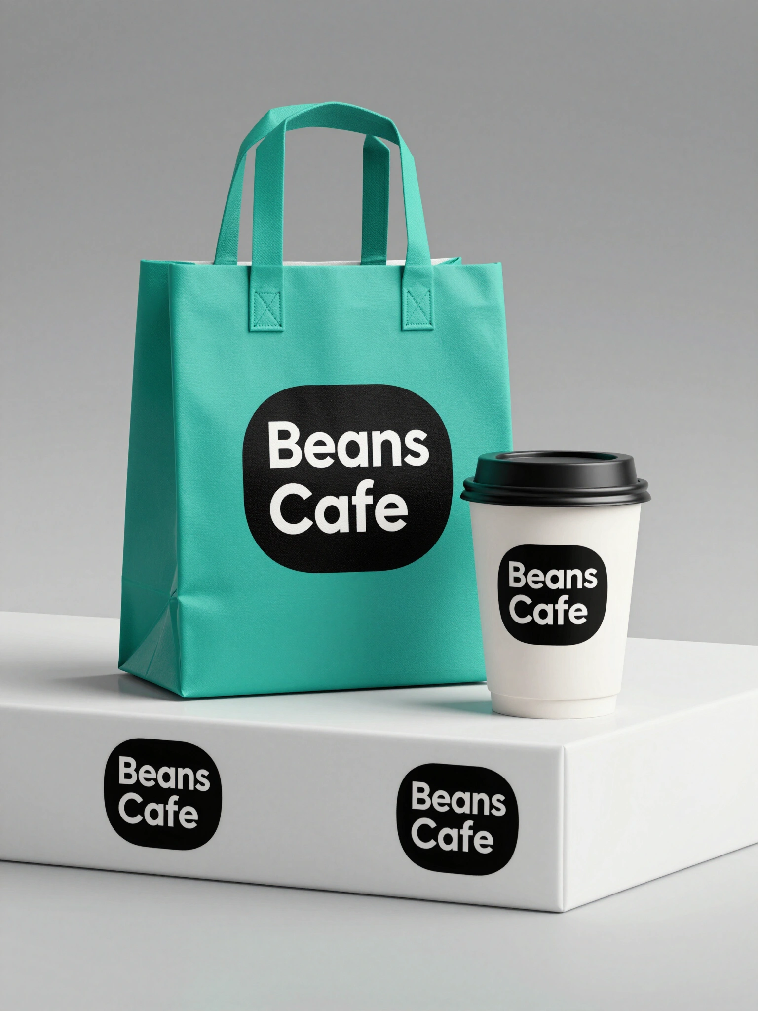 Beans Cafe branded coffee shop merchandise and packaging featuring a tote bag, coffee cups, and a box in a modern minimalist setting.