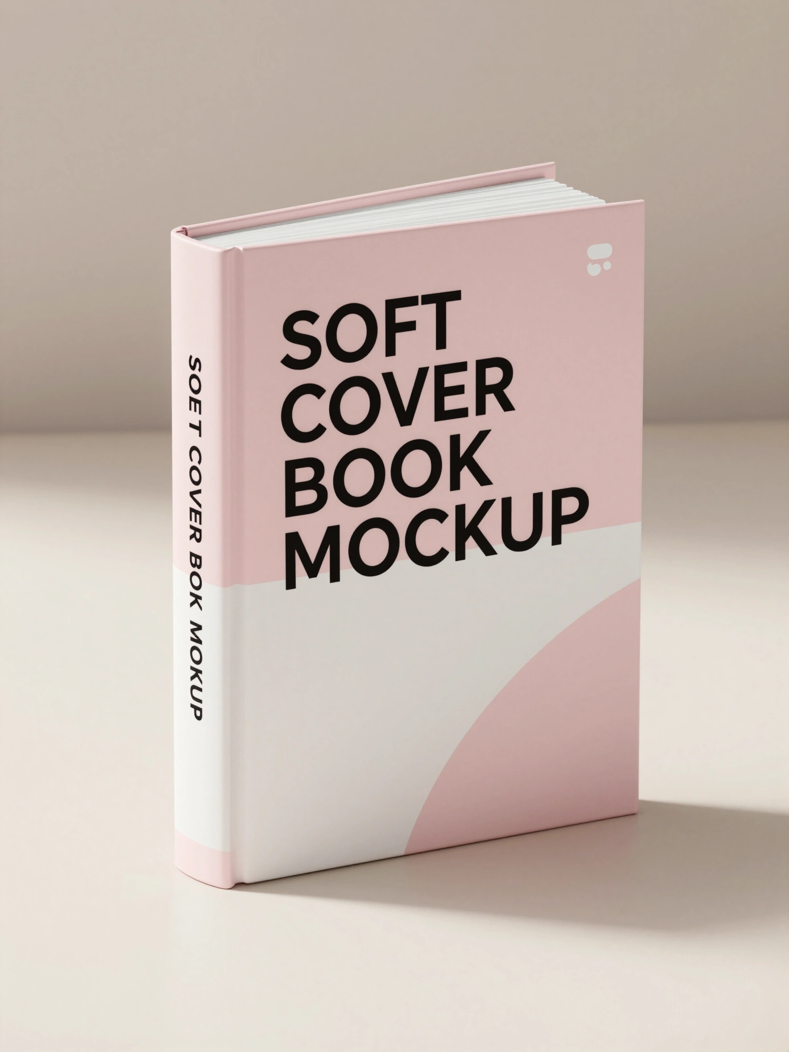 Softcover book mockup with pink and white cover, standing upright on a beige surface